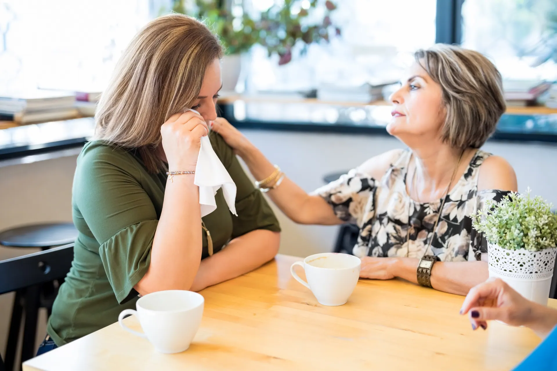 Two people sharing over coffee